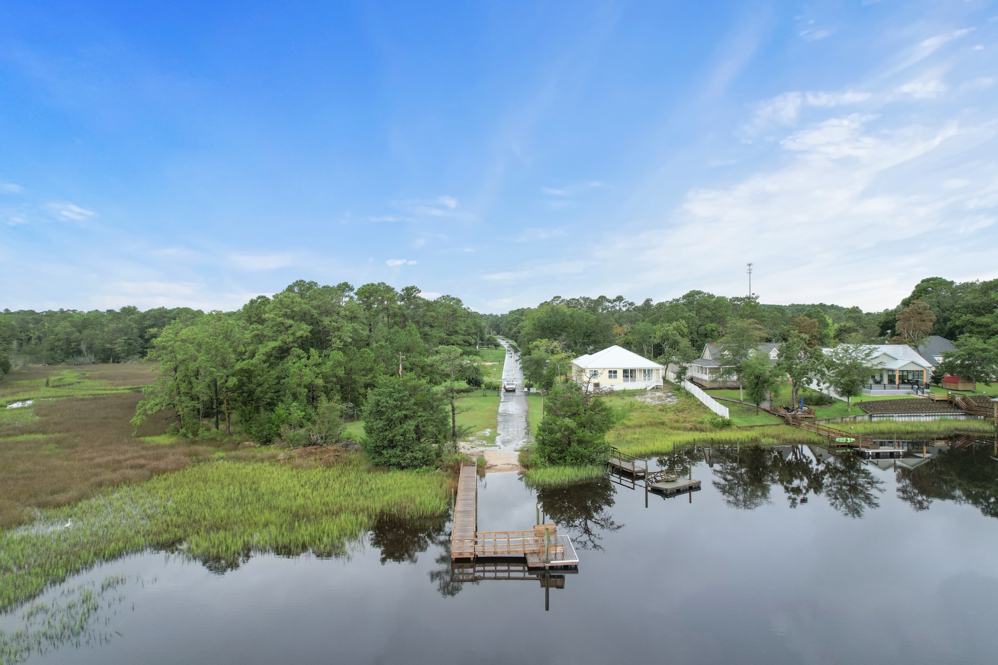 The Riverside community dock and boat ramp beside neighborhood homes